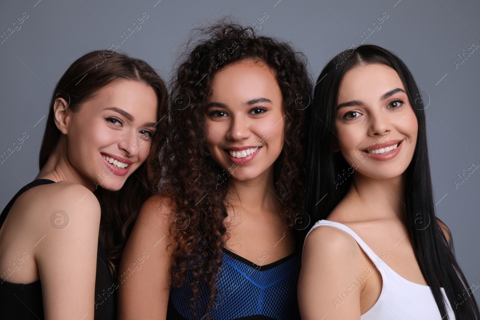 Photo of Portrait of beautiful women on grey background