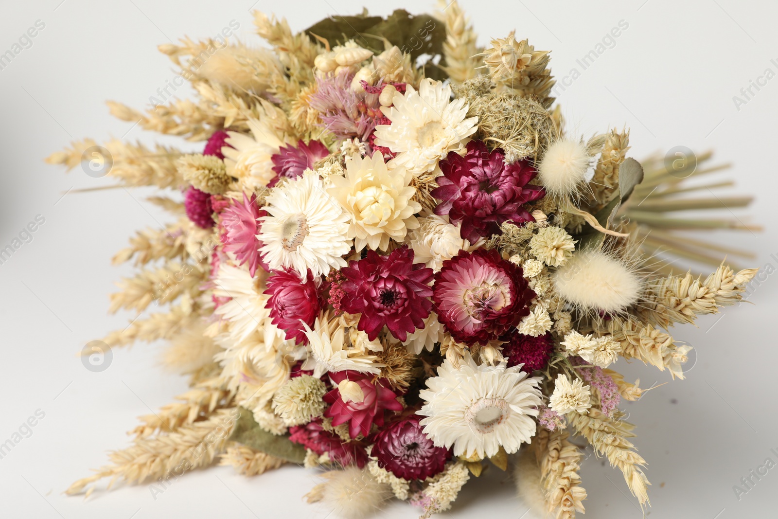 Photo of Beautiful bouquet of dry flowers on white background, closeup