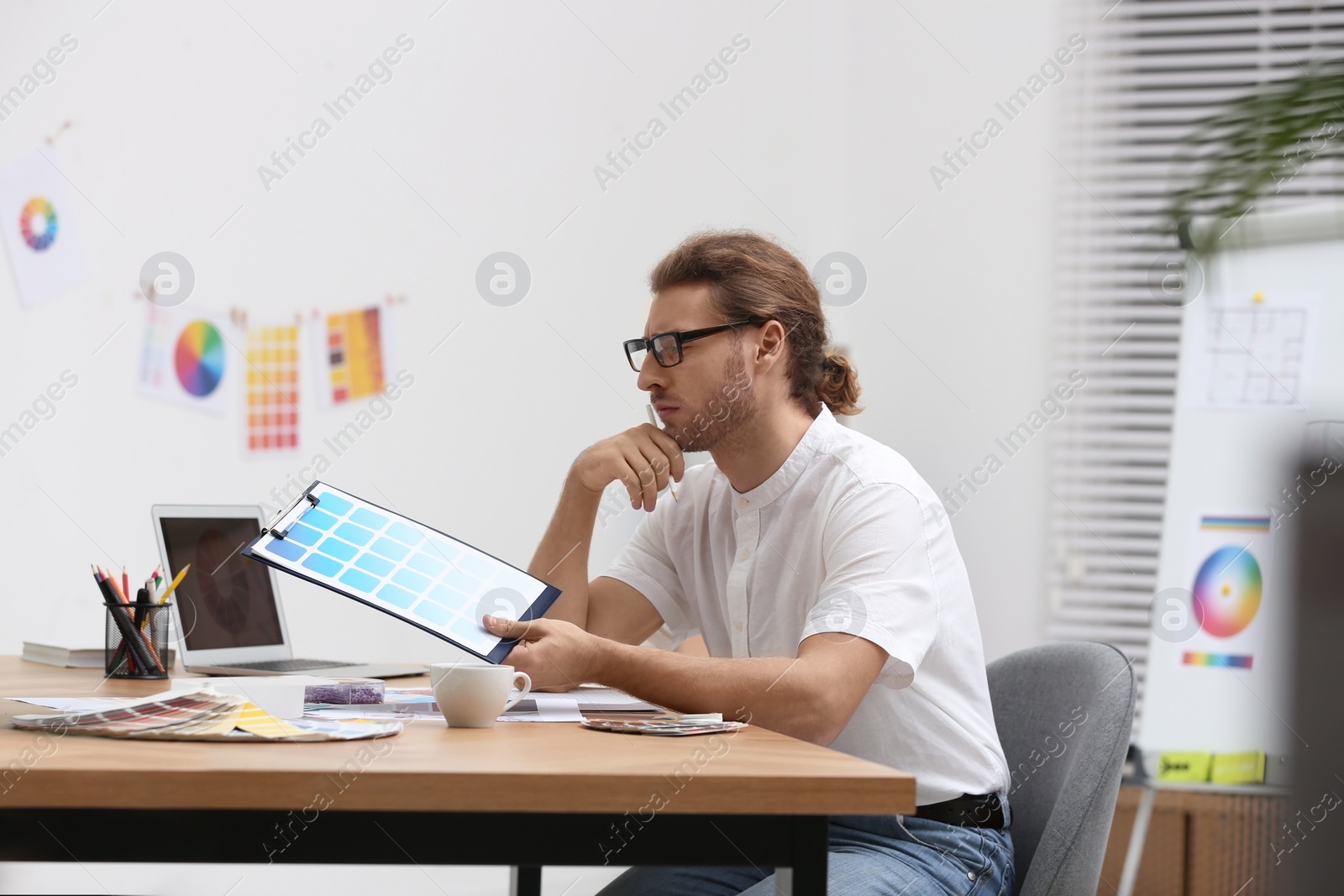 Photo of Professional interior designer at workplace in office