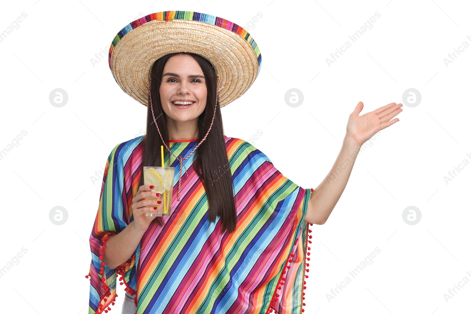 Photo of Young woman in Mexican sombrero hat and poncho with cocktail on white background