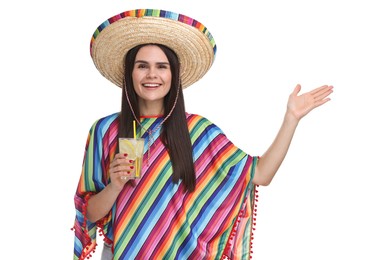 Photo of Young woman in Mexican sombrero hat and poncho with cocktail on white background