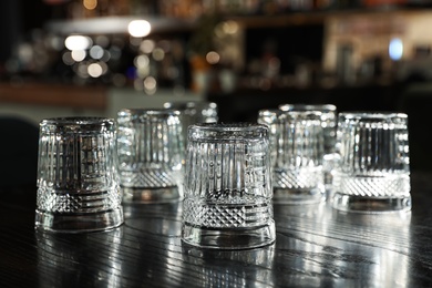 Empty clean glasses on counter in modern bar