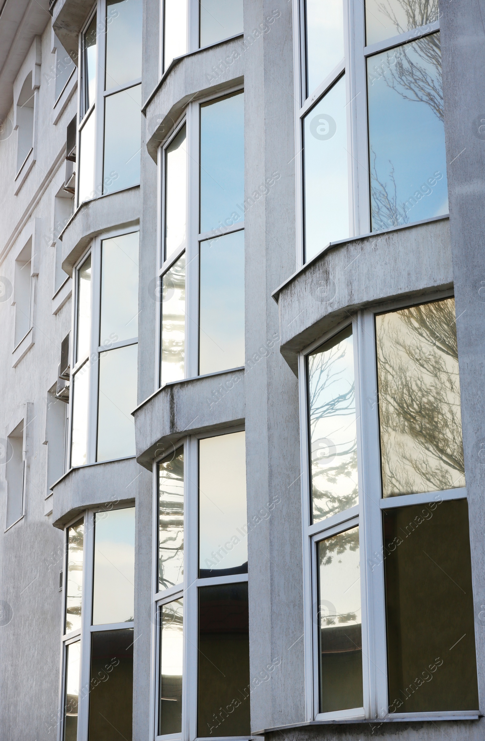 Photo of Modern office building with tinted windows. Urban architecture