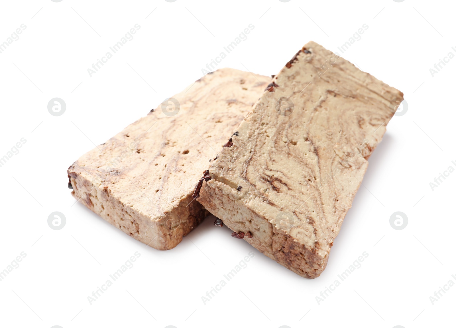 Photo of Pieces of tasty chocolate halva isolated on white