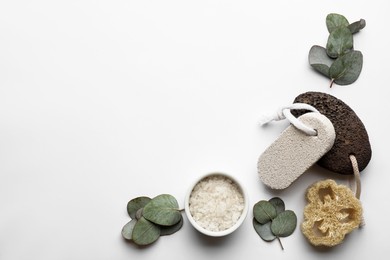 Flat lay composition with pumice stones on light background. Space for text