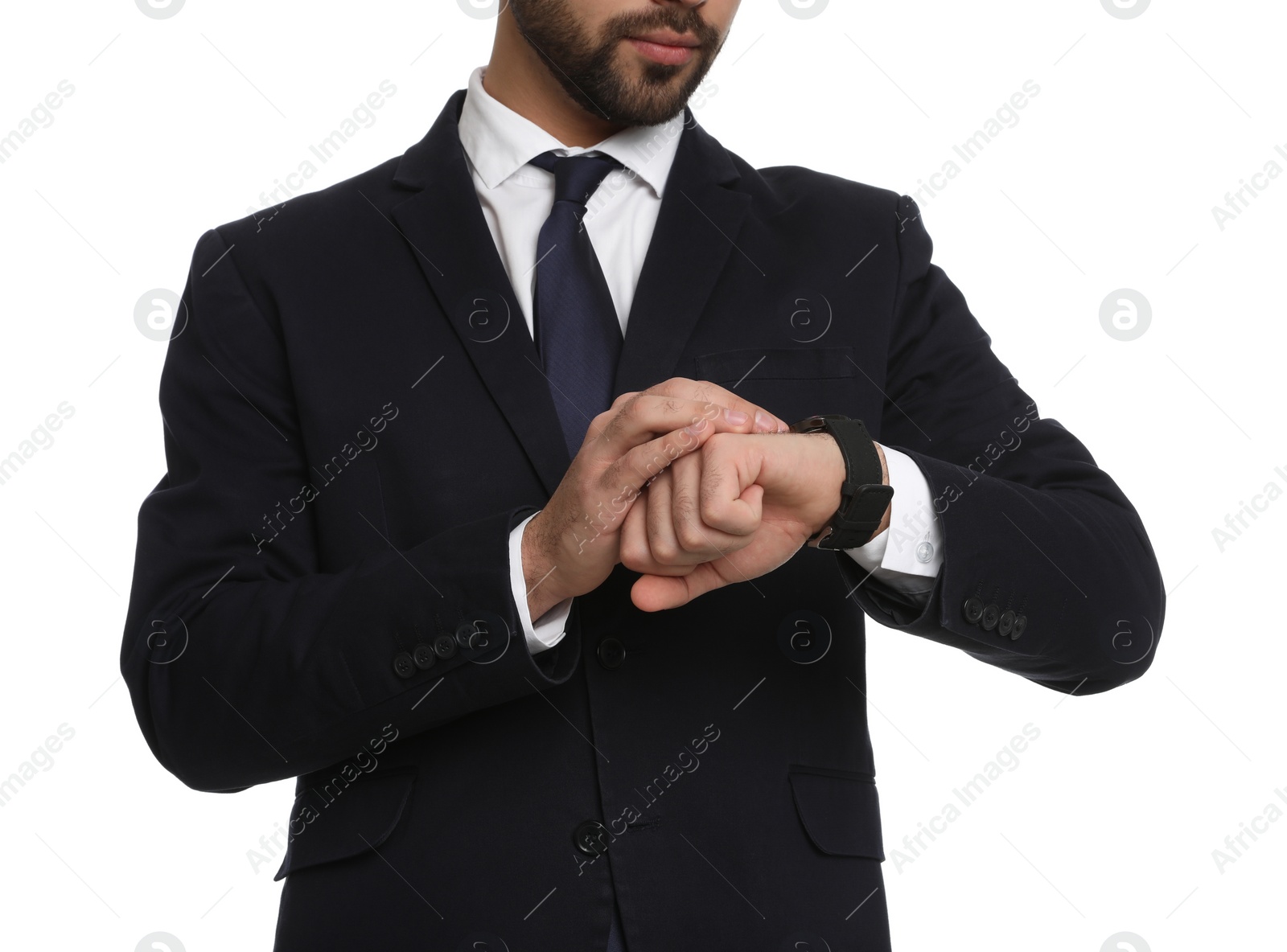 Photo of Young businessman checking time on white background, closeup