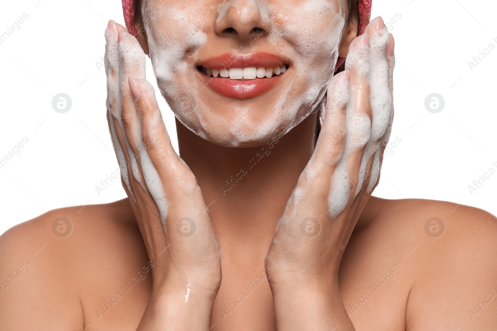 Photo of Beautiful woman applying facial cleansing foam on white background, closeup