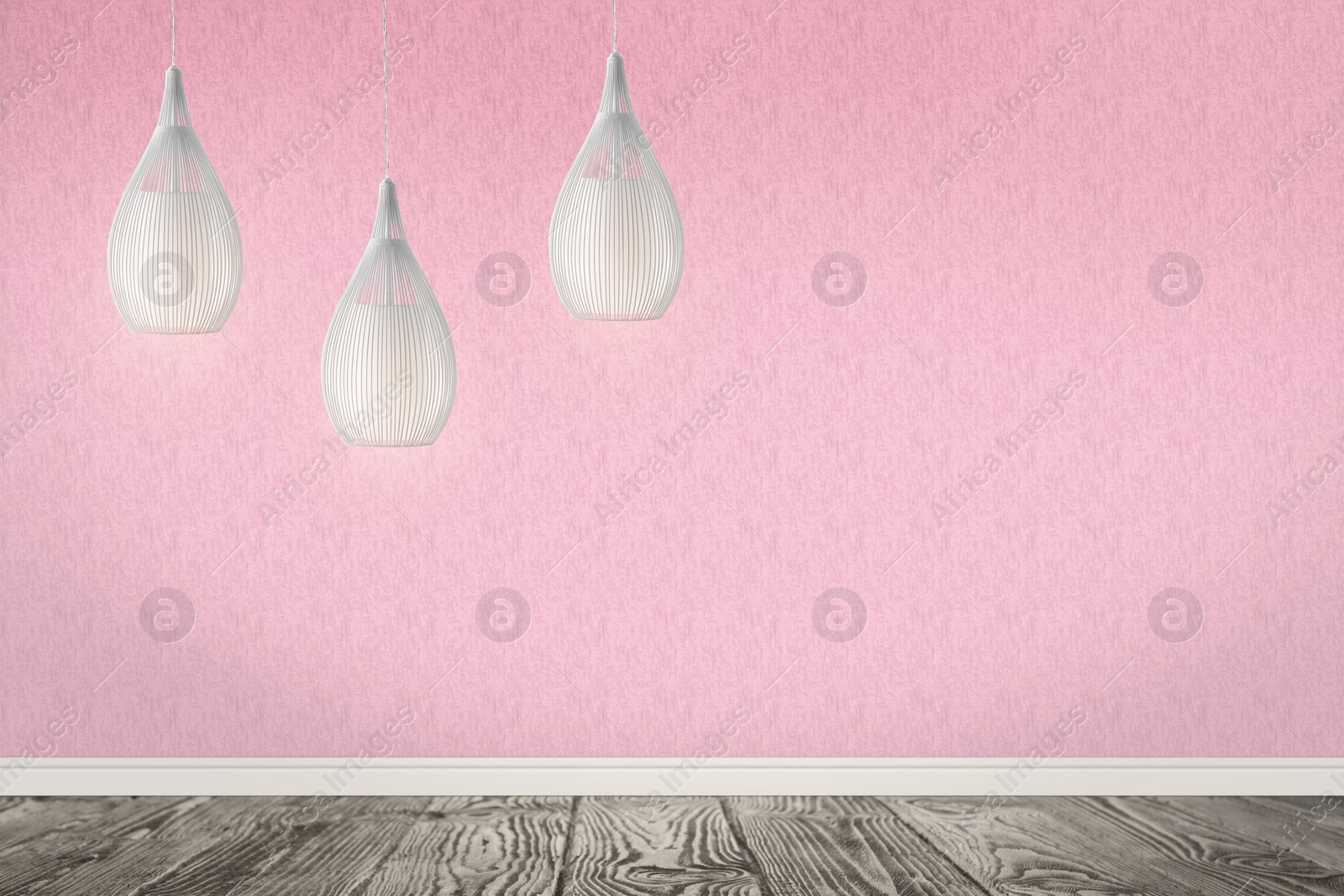 Image of Stylish pendant lamps hanging near pink wall in room