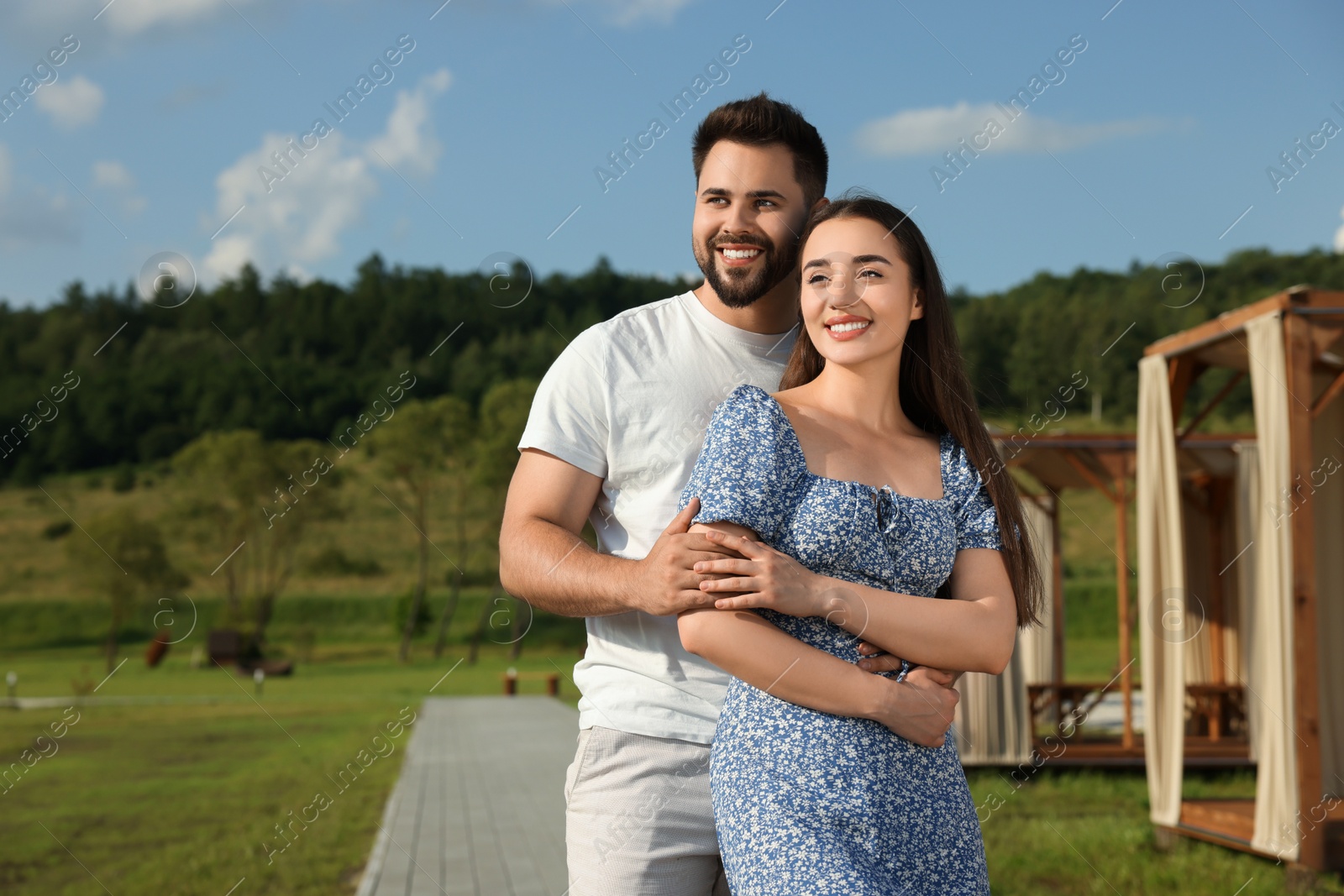 Photo of Romantic date. Beautiful couple spending time together outdoors, space for text