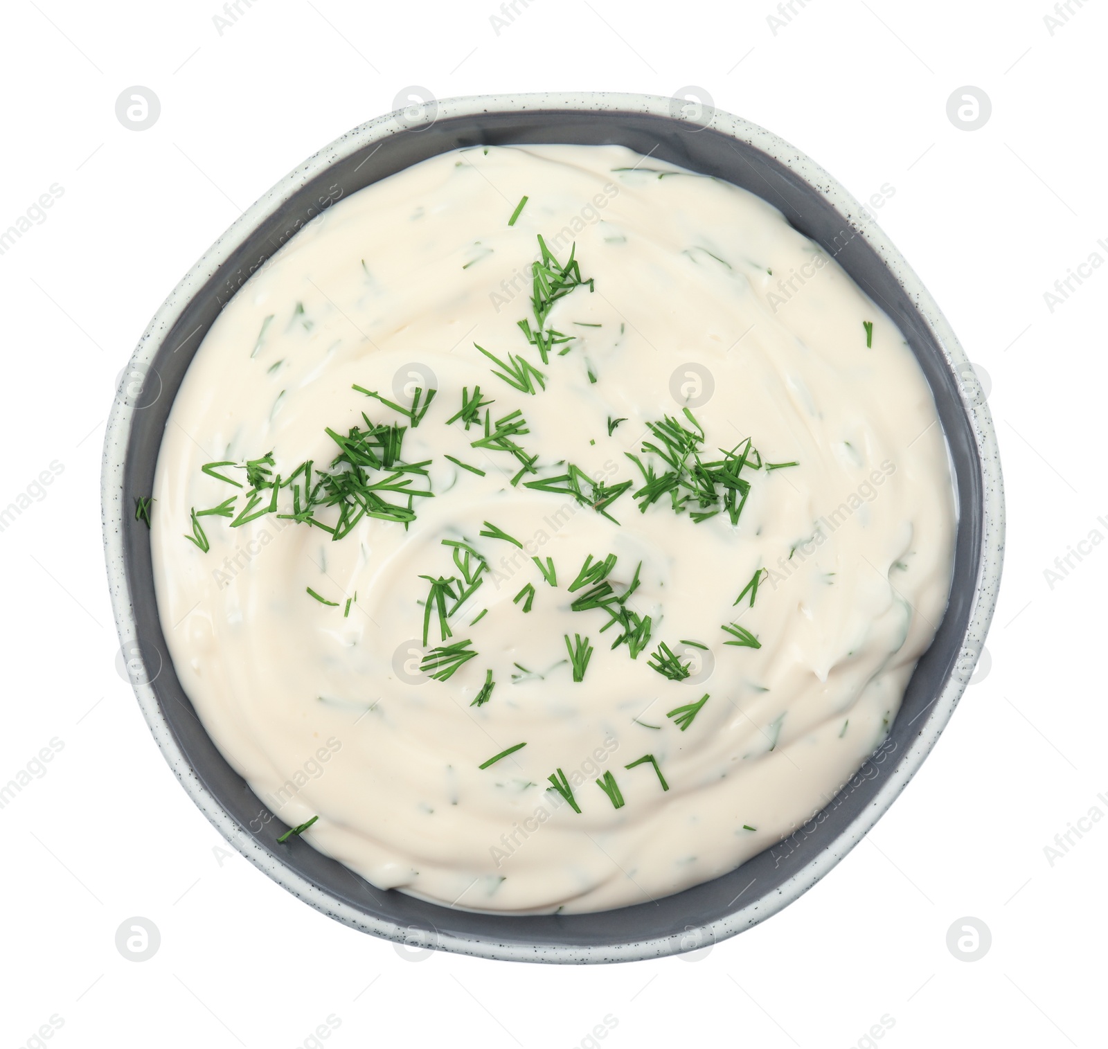 Photo of Tasty creamy dill sauce in bowl isolated on white, top view