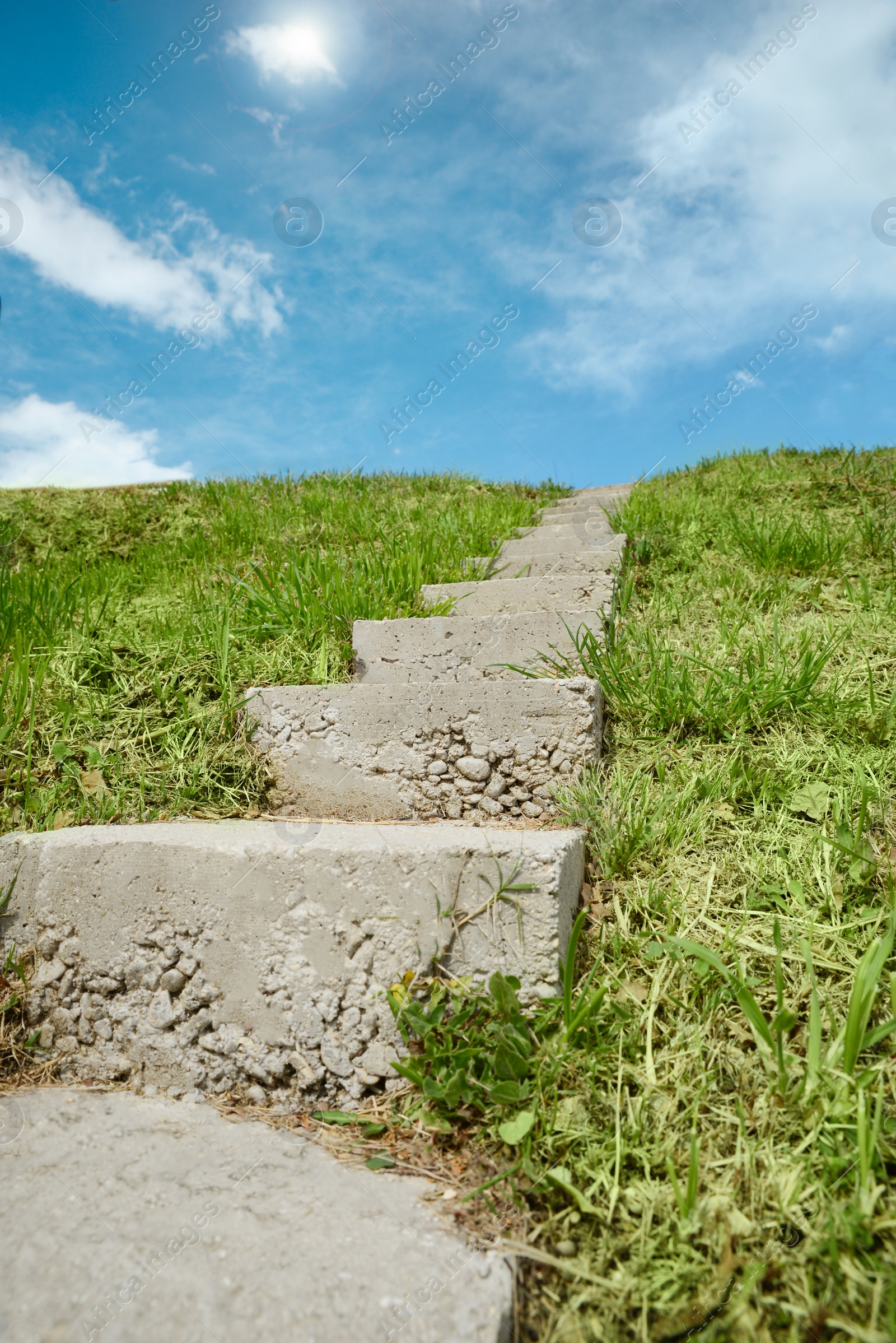 Photo of Outdoor concrete staircase up to hill, low angle view