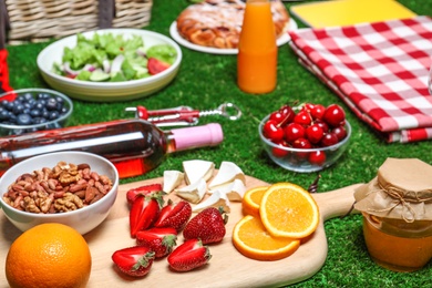 Many different products on green grass. Summer picnic