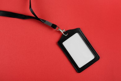 Photo of Blank badge on red background, top view. Mockup for design