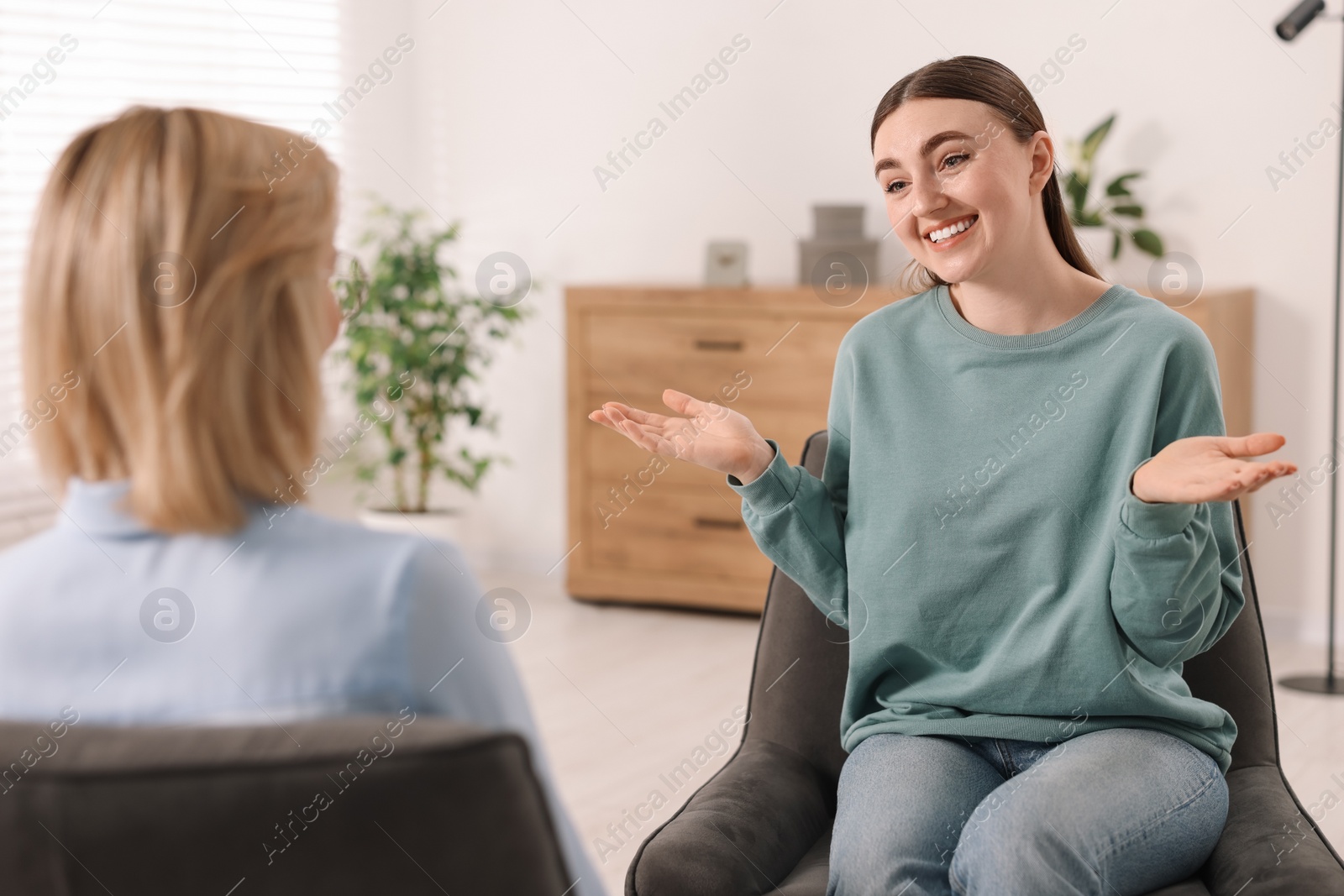 Photo of Professional psychotherapist working with patient in office