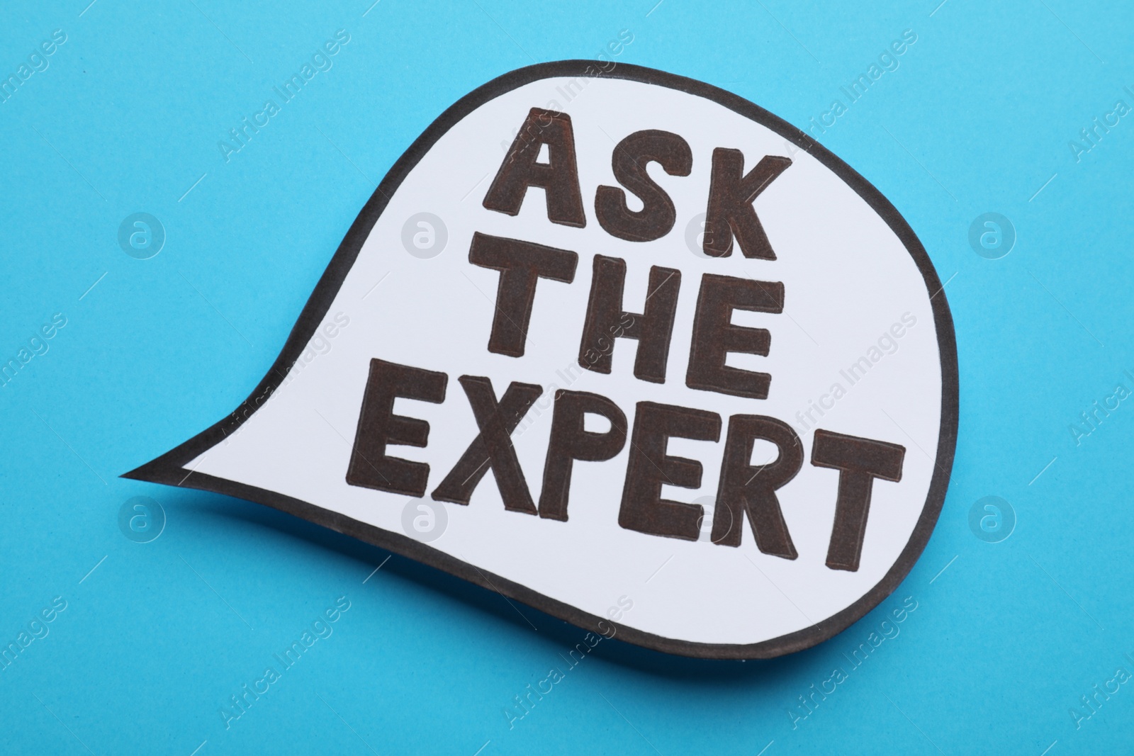 Photo of Speech bubble sticker with phrase Ask The Expert on light blue background