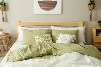 Photo of Comfortable wooden bed in room. Stylish interior