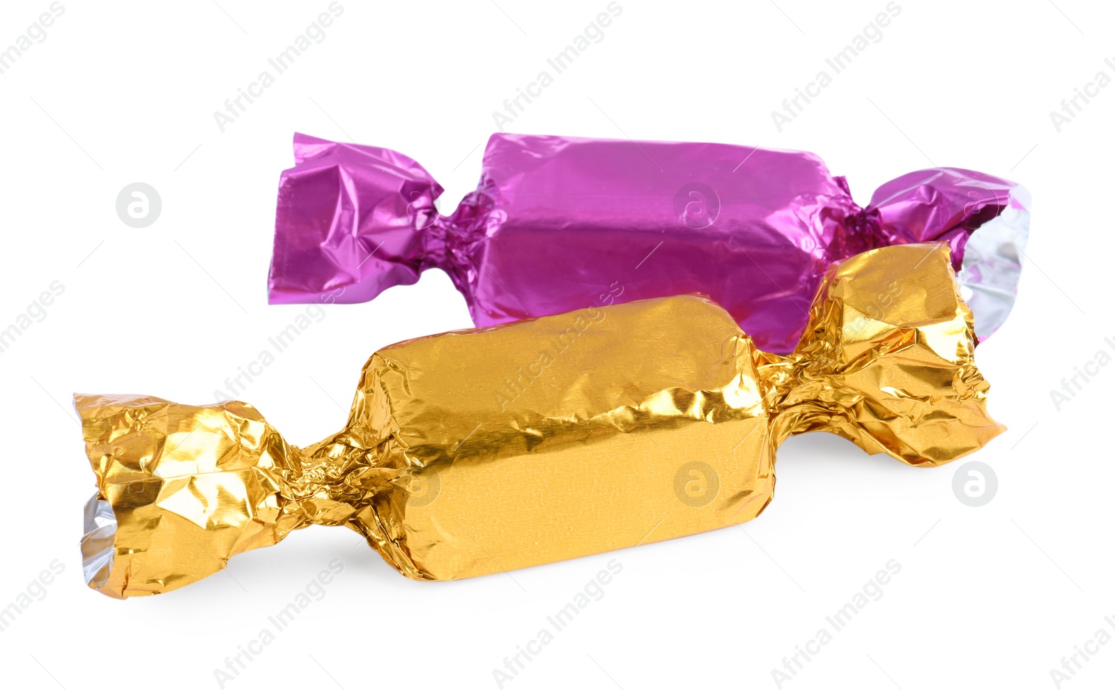 Photo of Two candies in colorful wrappers isolated on white