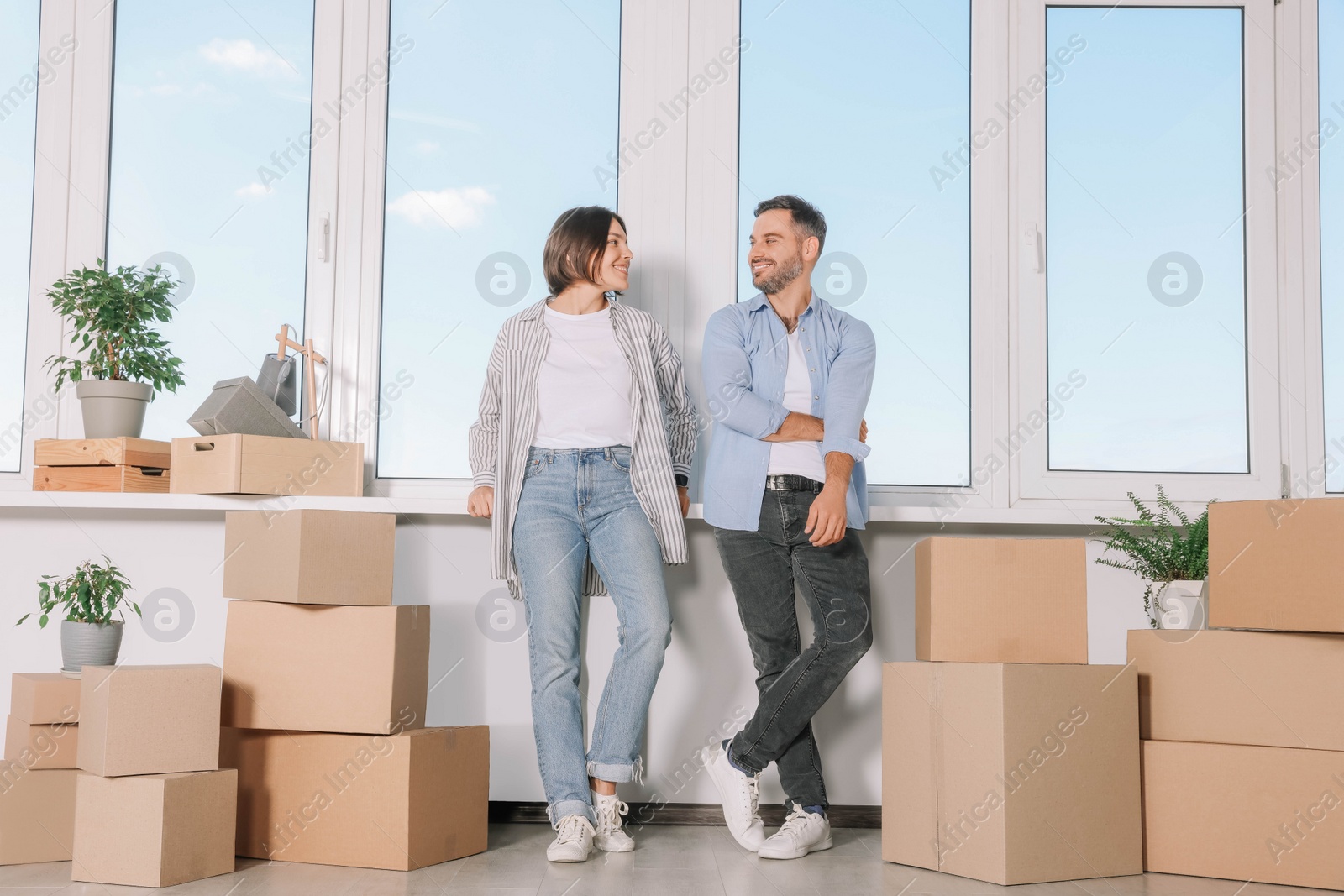 Photo of Happy couple in new apartment. Moving day