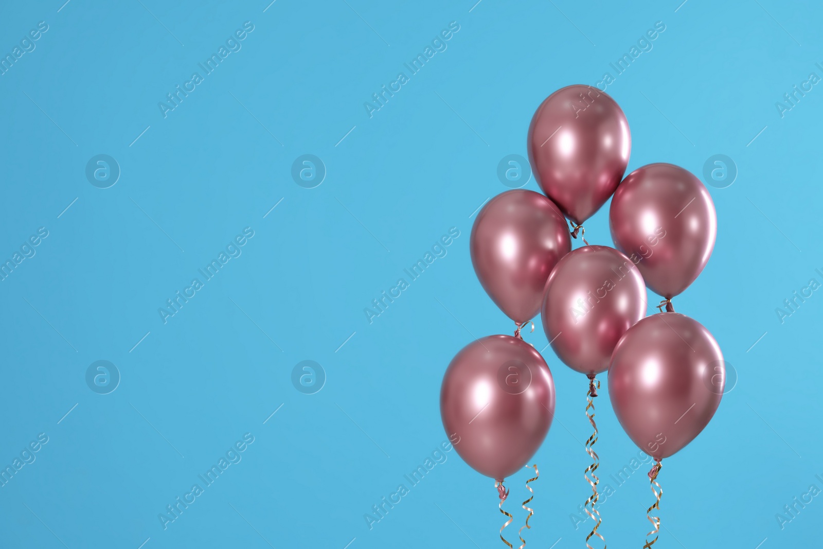 Photo of Bright balloons on color background. Space for text