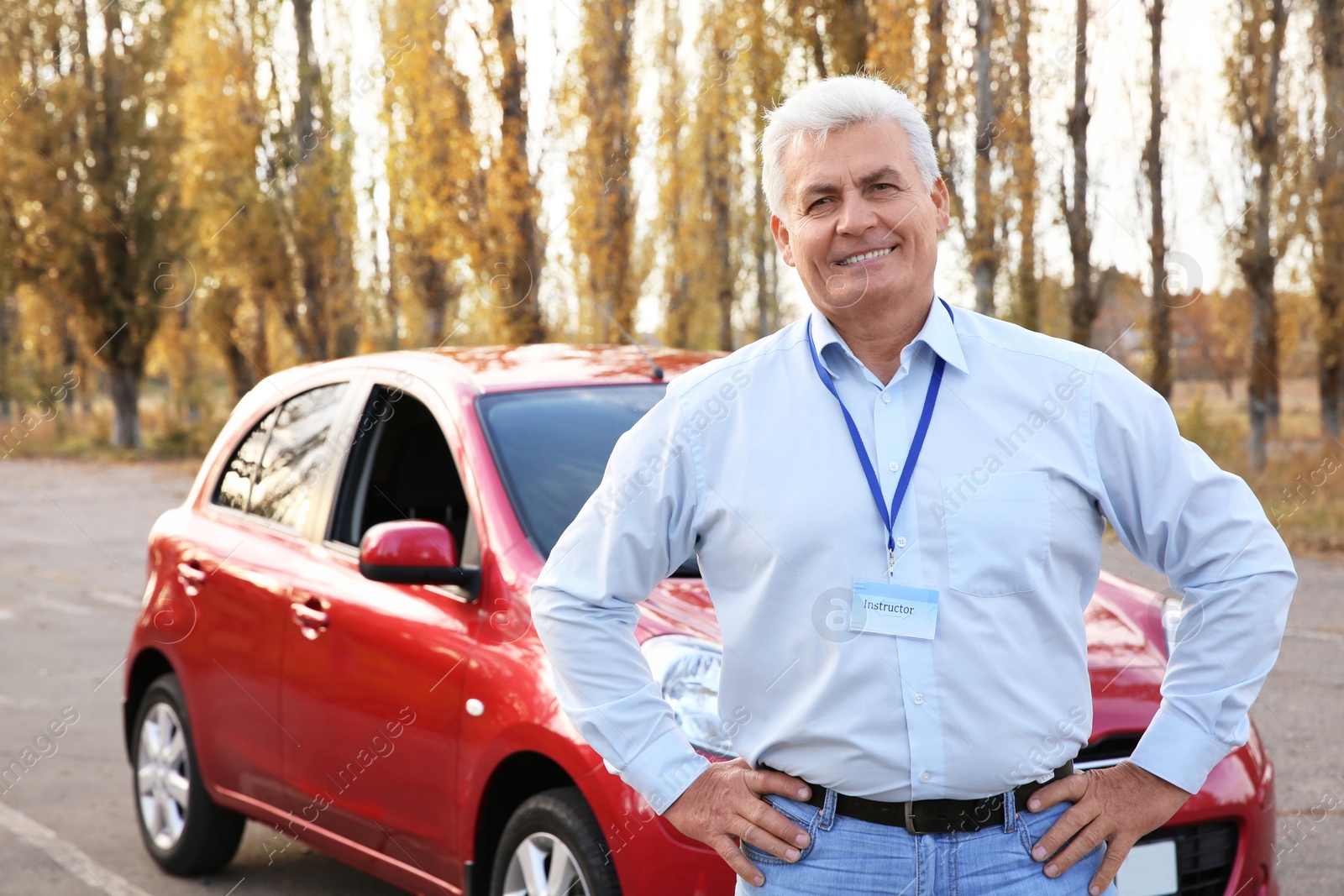 Photo of Senior instructor near modern car outdoors. Get driving license