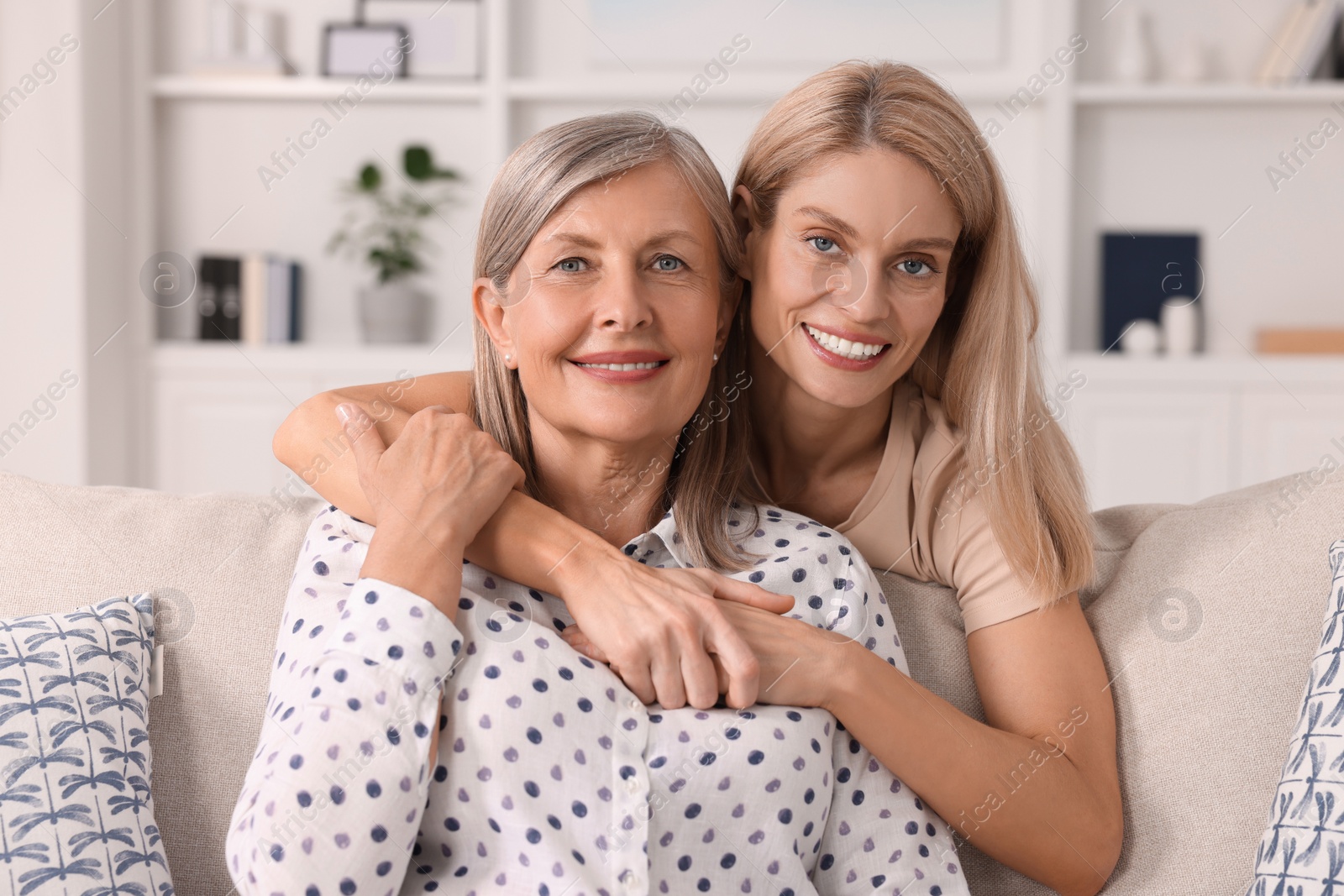 Photo of Happy mature mother and her daughter at home