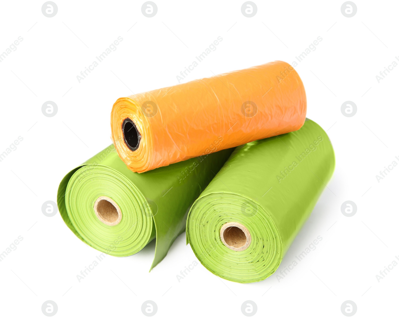 Photo of Colorful dog waste bags on white background