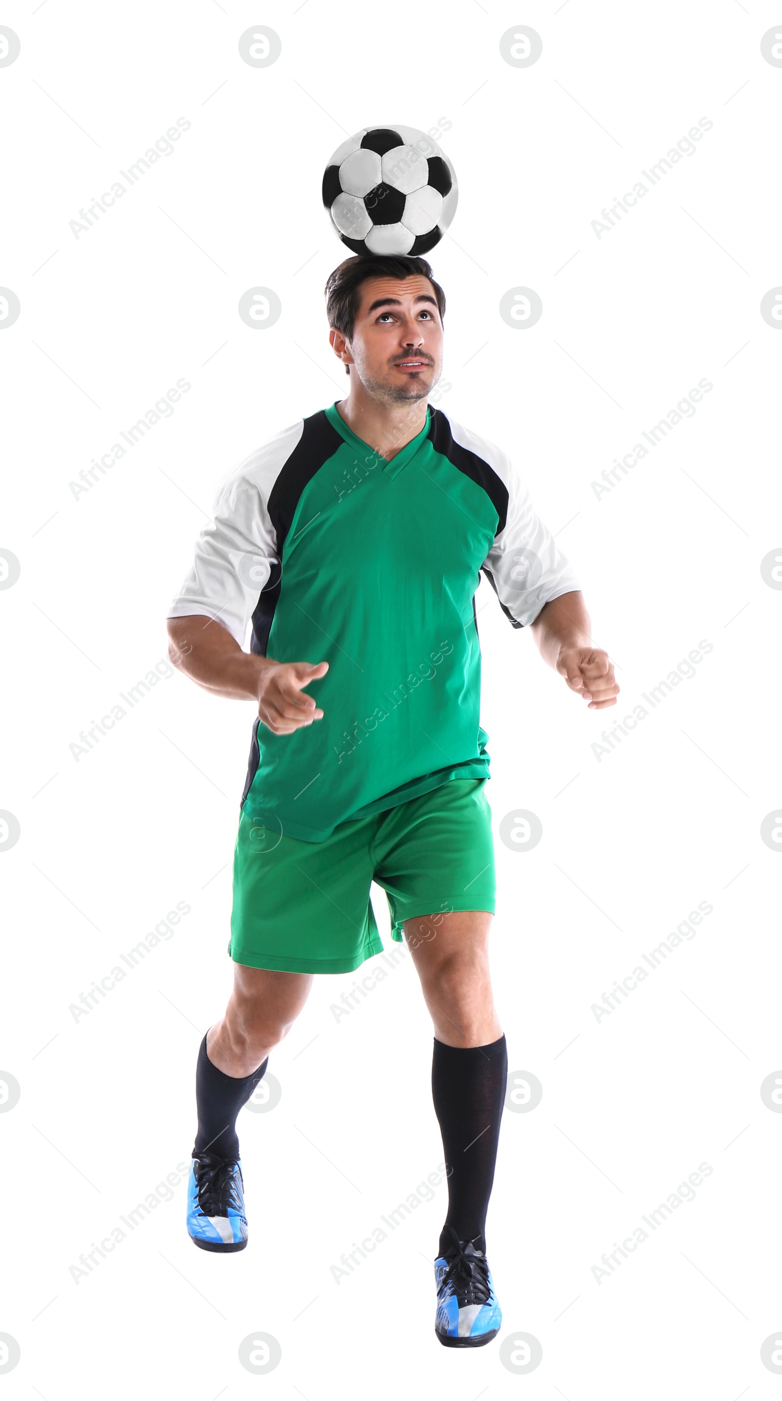 Photo of Young man playing football on white background