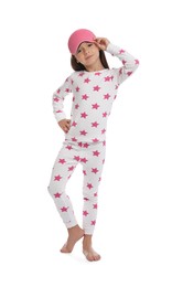 Photo of Cute girl wearing pajamas and sleeping mask on white background