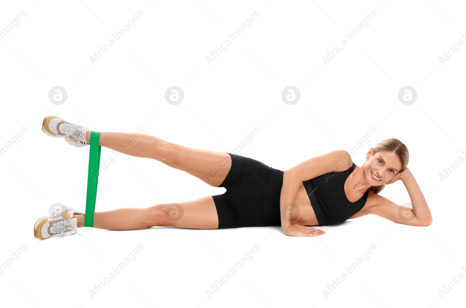 Photo of Woman exercising with elastic resistance band on white background