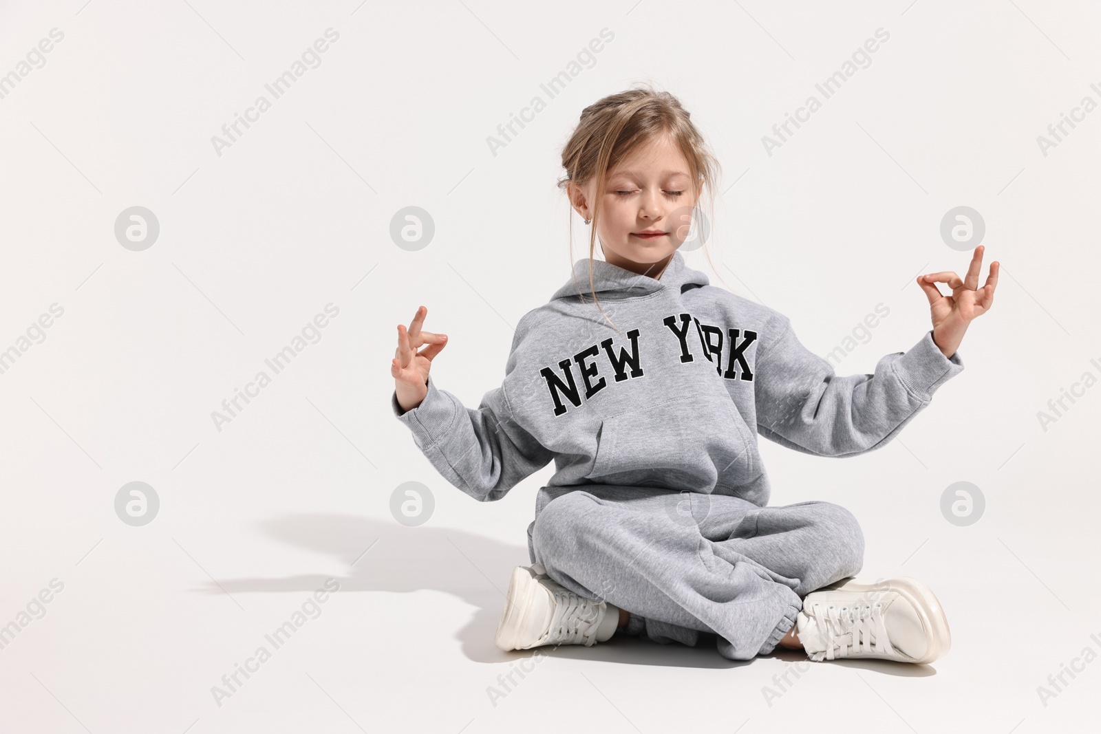 Photo of Fashion concept. Stylish girl posing on white background