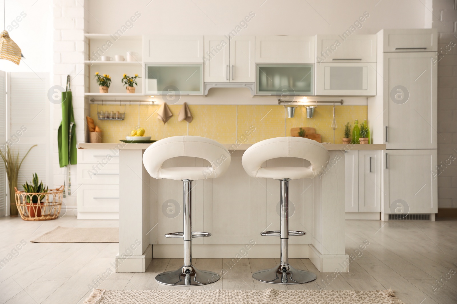 Photo of Modern kitchen interior with stylish white furniture