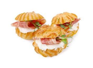 Photo of Delicious profiteroles with cream cheese and prosciutto isolated on white