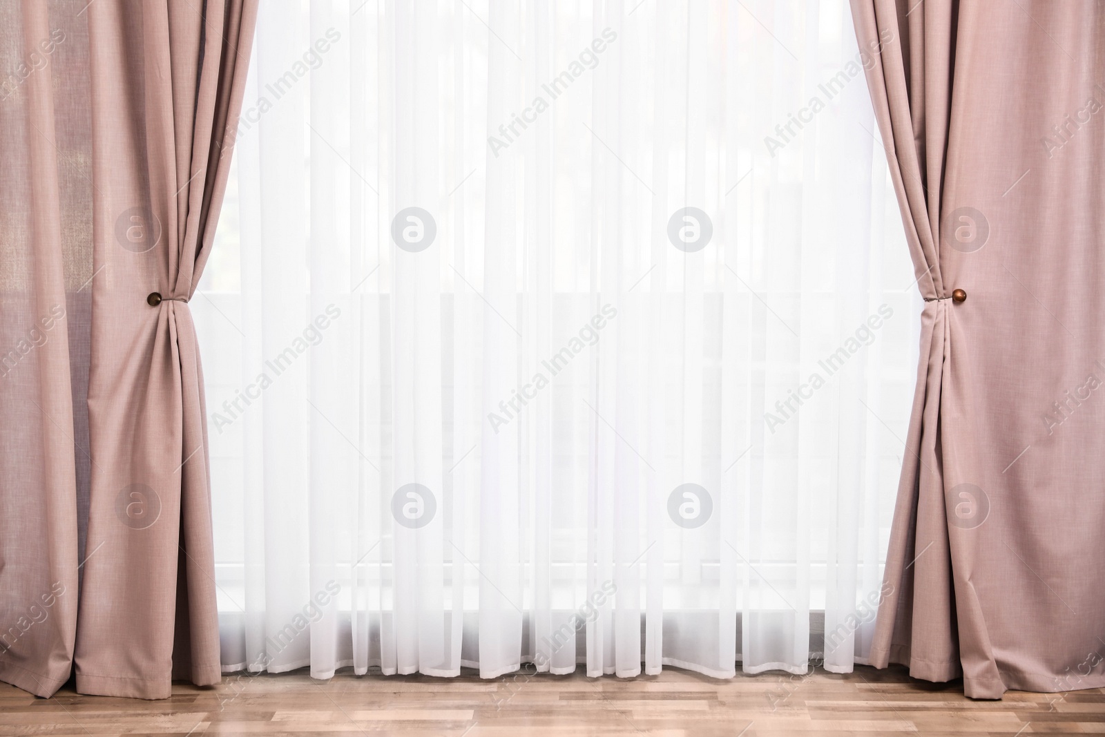 Photo of Window with elegant curtains in empty room