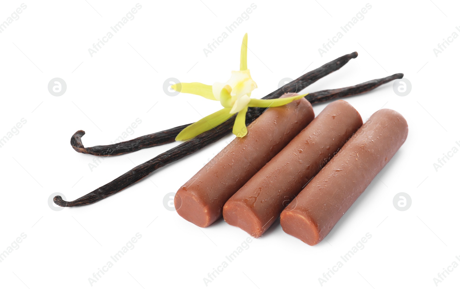 Photo of Glazed curd cheese bars, vanilla pods and flower isolated on white