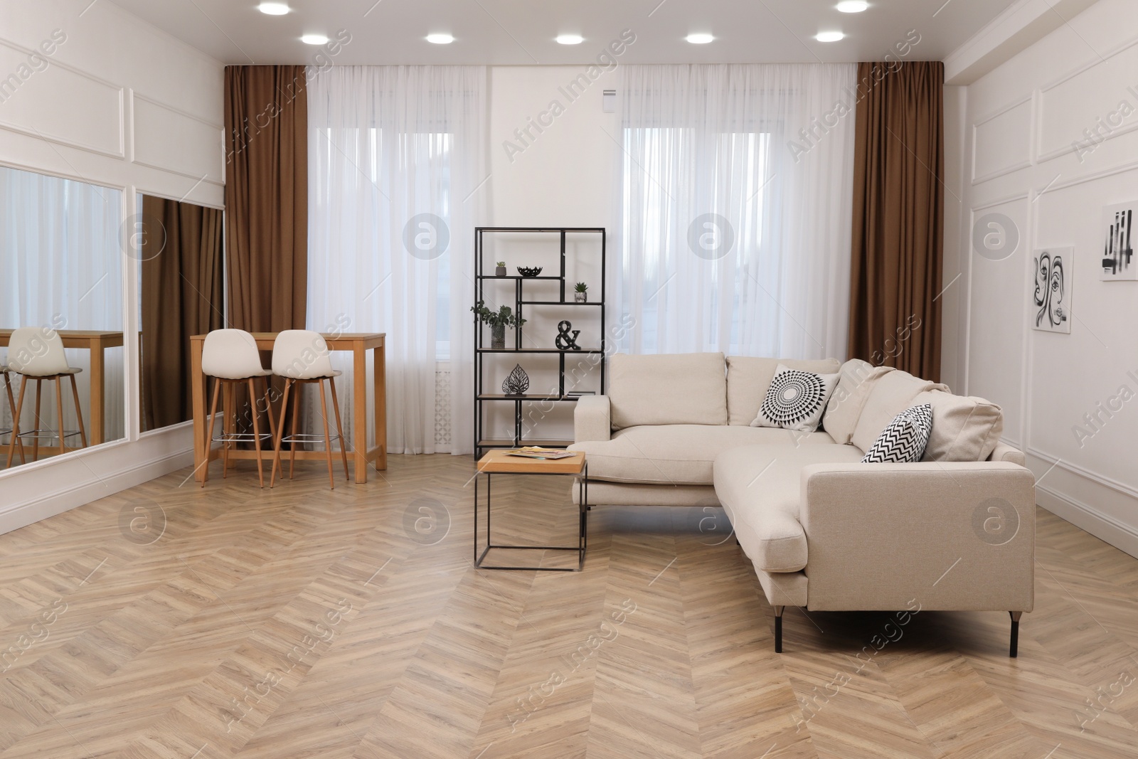 Photo of Modern living room with parquet flooring and stylish furniture