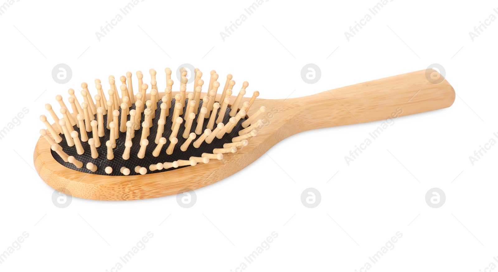 Photo of One new wooden hairbrush isolated on white