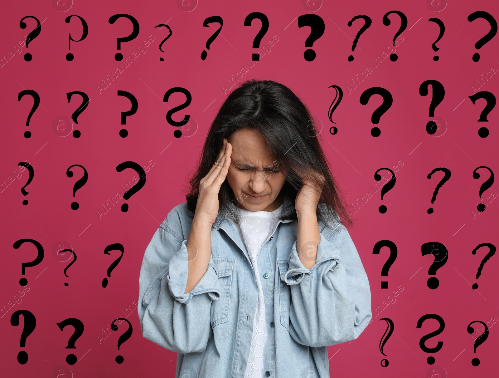 Image of Amnesia. Confused woman and question marks on pink background