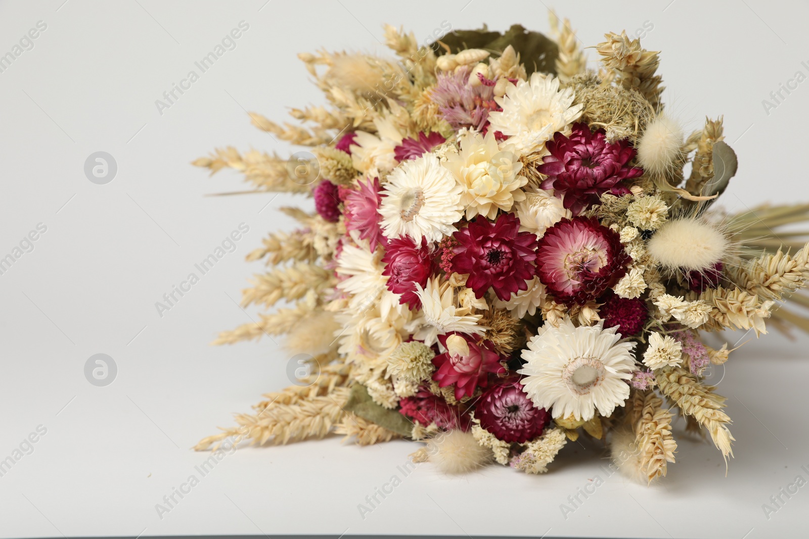 Photo of Beautiful bouquet of dry flowers on white background, space for text