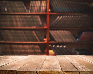 Empty wooden table in library. Space for design 