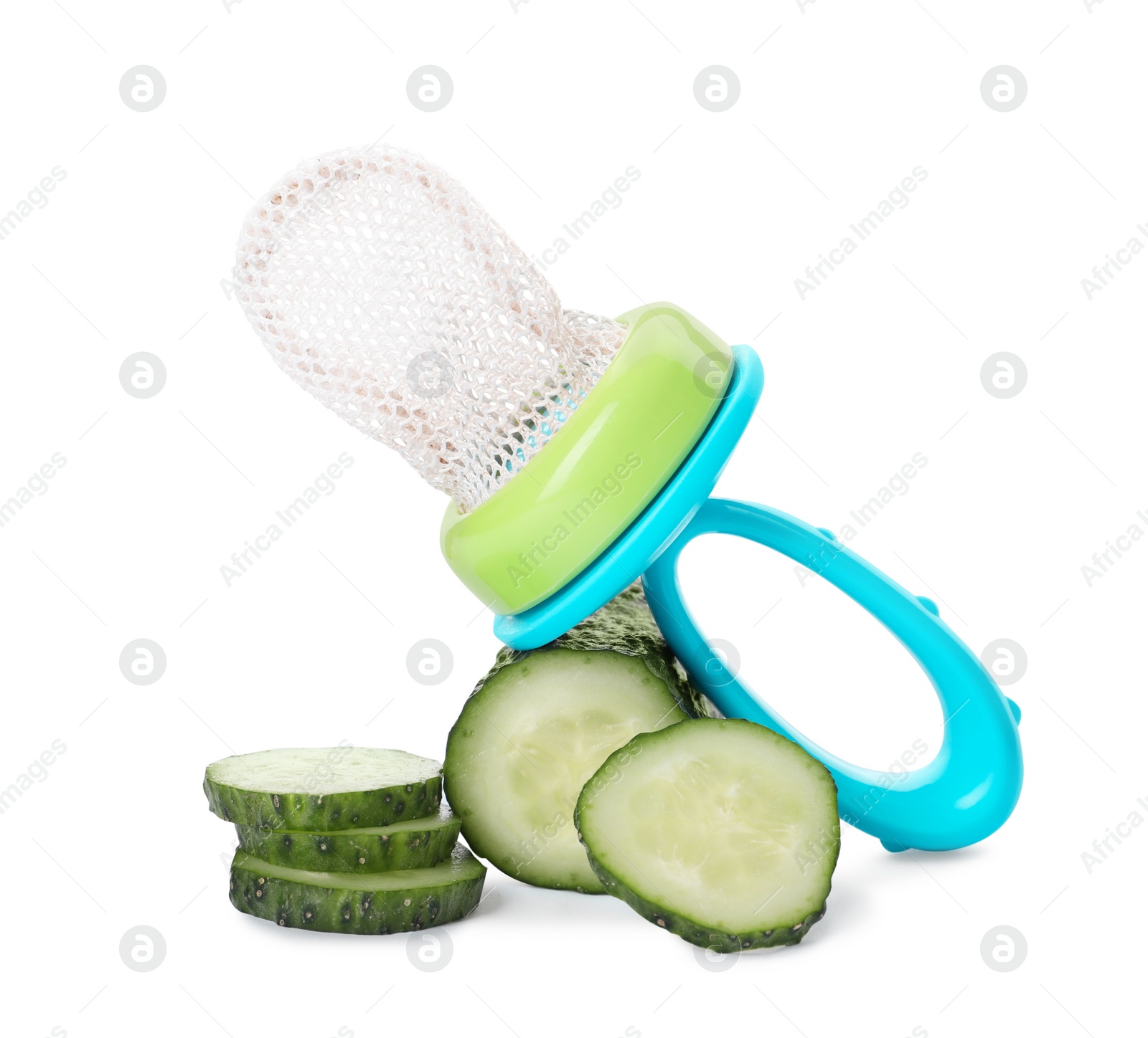 Photo of Empty nibbler and cut cucumber on white background. Baby feeder