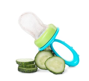 Empty nibbler and cut cucumber on white background. Baby feeder