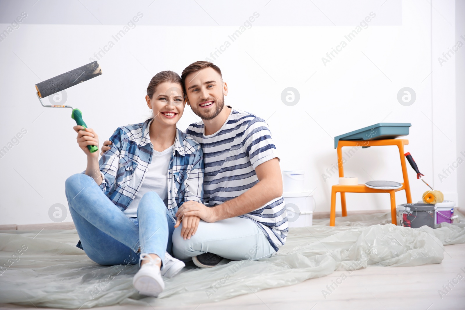 Photo of Young couple during apartment renovation, indoors