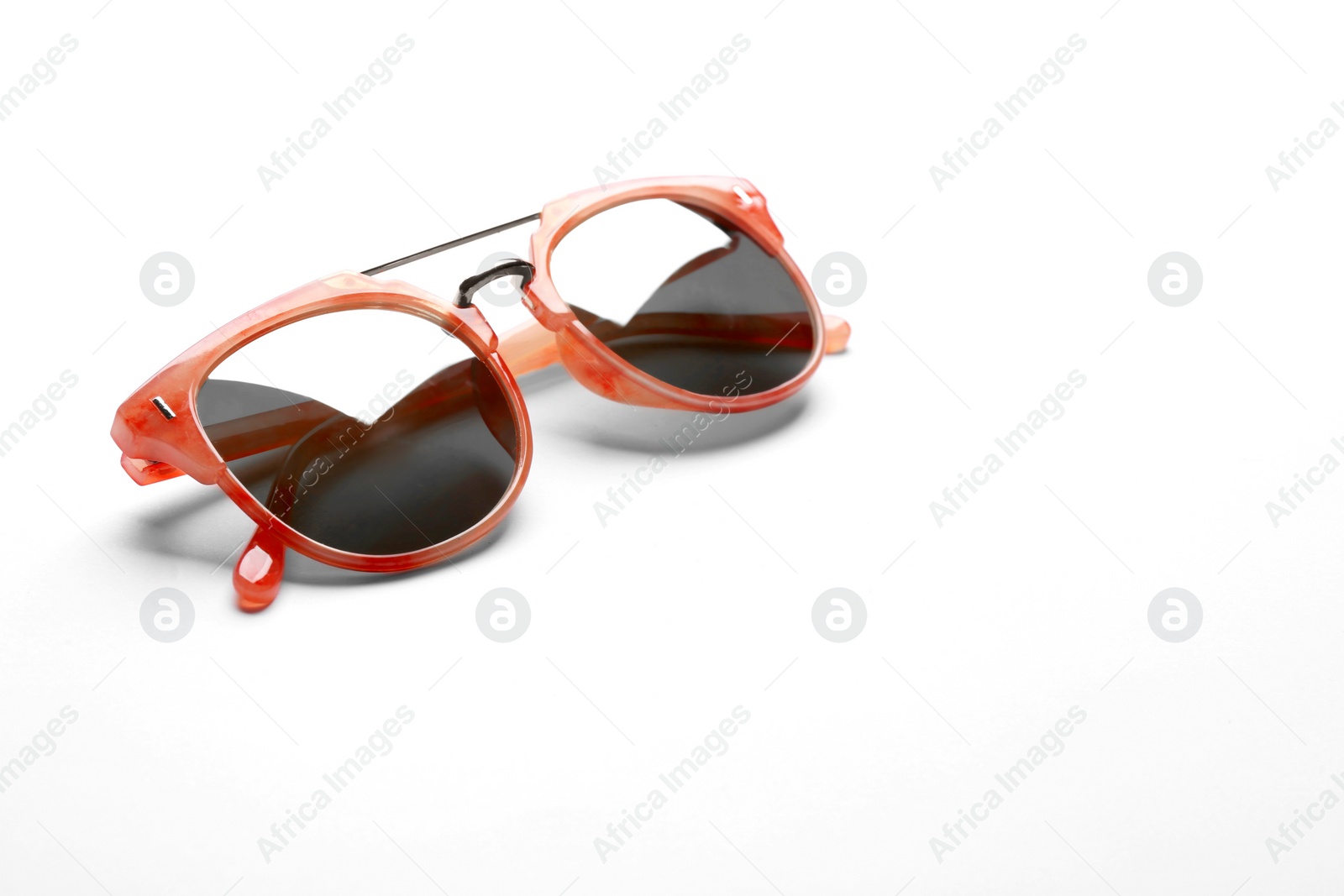 Photo of Stylish sunglasses on white background. Fashionable accessory