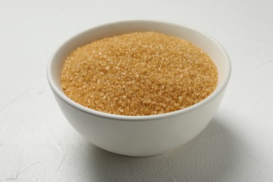Photo of Brown sugar in bowl on white table