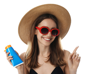 Photo of Young woman with sun protection cream on white background