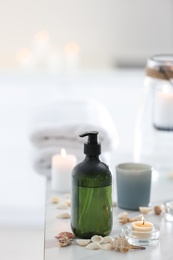 Soap dispenser and decor elements on table