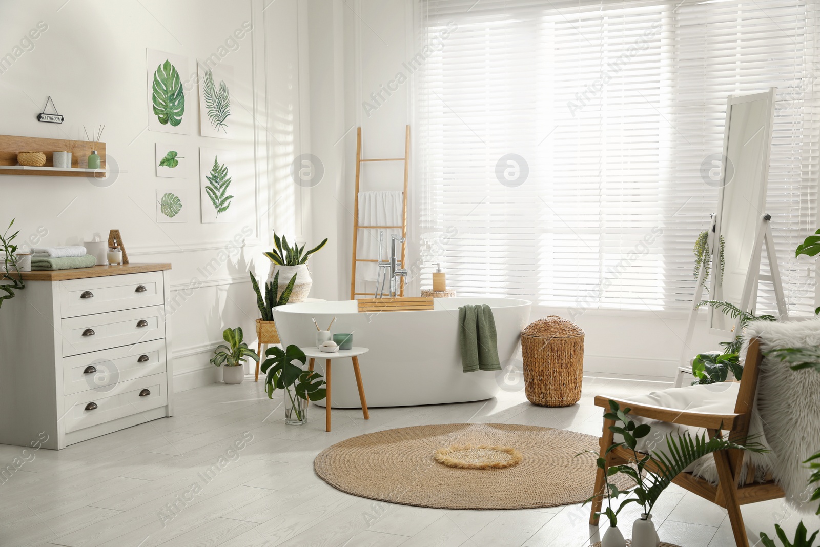 Photo of Stylish bathroom interior with green plants. Home design