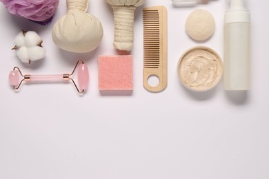 Bath accessories. Flat lay composition with personal care products on white background, space for text