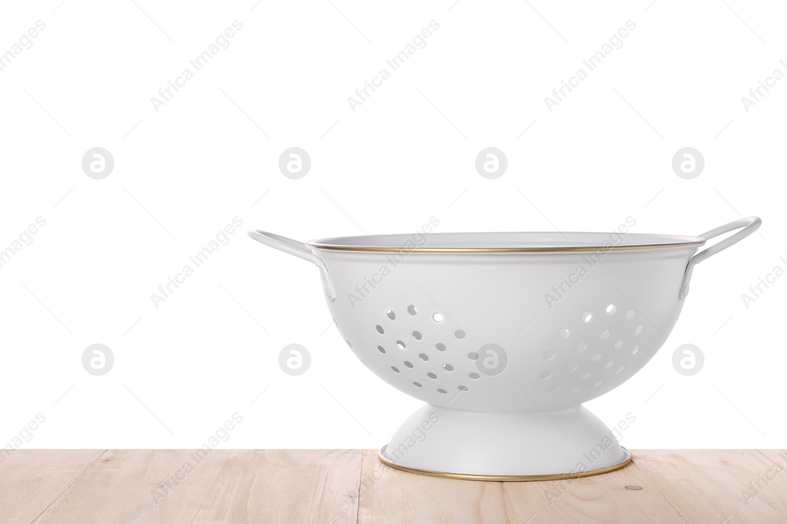 Photo of One empty colander on wooden table against white background. Space for text