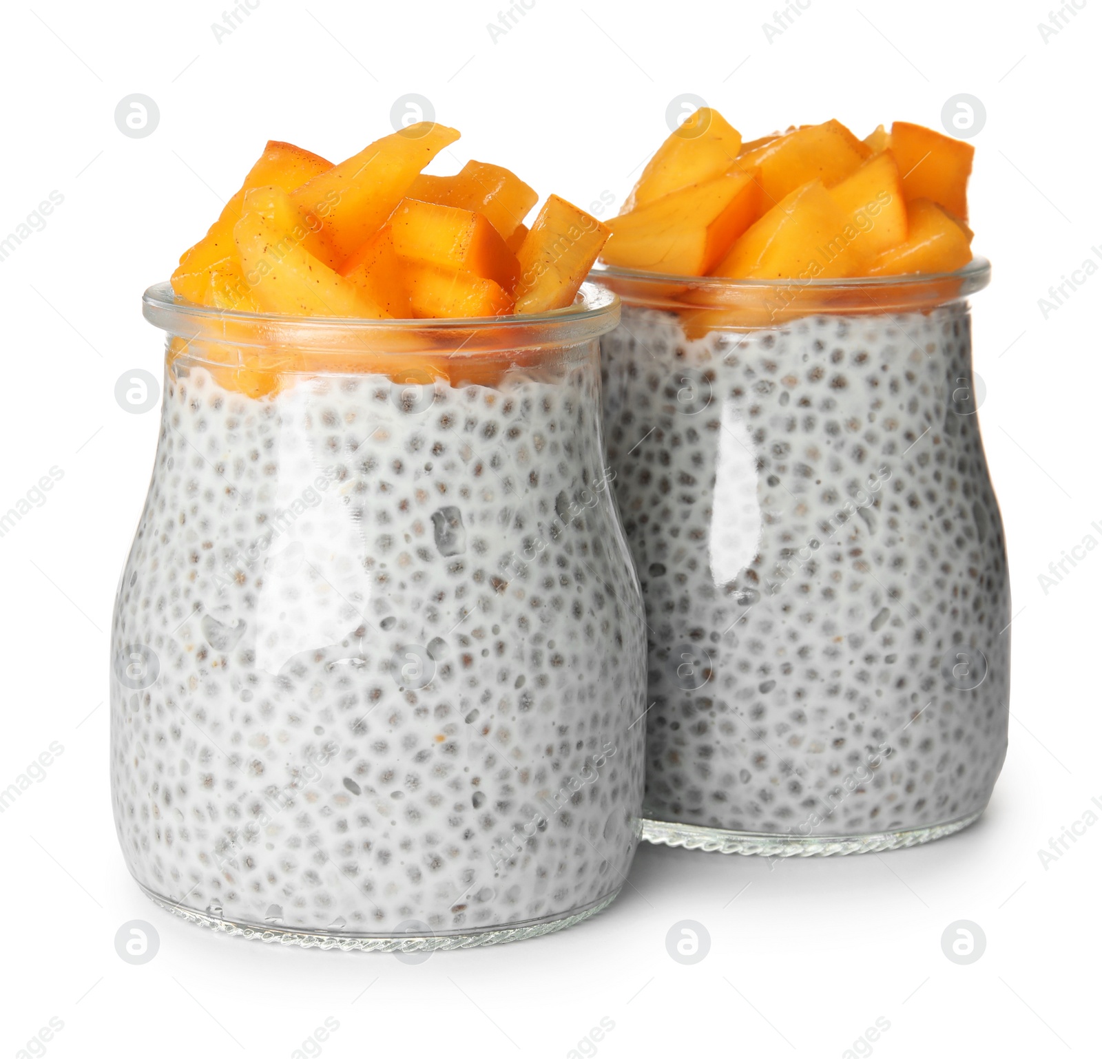 Photo of Jars of tasty chia seed pudding with persimmon isolated on white